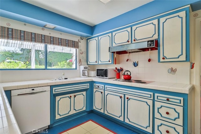 17313 Citronia St, Northridge, CA 91325 - kitchen featuring white appliances, under cabinet range hood, decorative backsplash, light tile patterned floors, and tile countertops