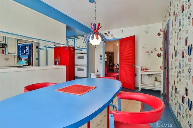 17313 Citronia St, Northridge, CA 91325 - dining space featuring tile patterned floors and wallpapered walls