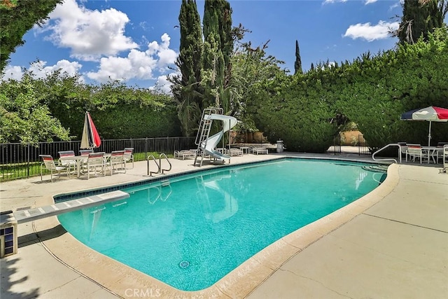 17313 Citronia St, Northridge, CA 91325 - view of swimming pool featuring a patio, a water slide, and outdoor dining space