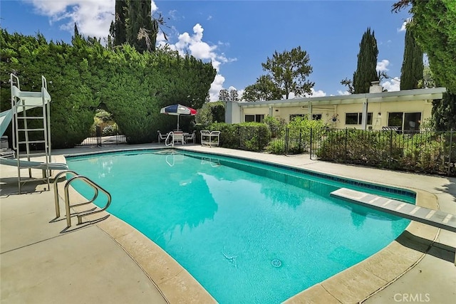 17313 Citronia St, Northridge, CA 91325 - view of pool featuring a diving board, a patio, and a water slide