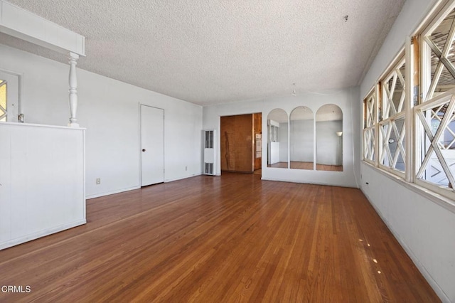 3180 Grove St, Ventura, CA 93003 - spare room with a textured ceiling and wood finished floors