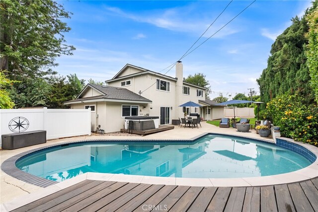 1161 Ravencrest Rd, North Tustin, CA 92705 - view of pool featuring a jacuzzi, a deck, and a patio