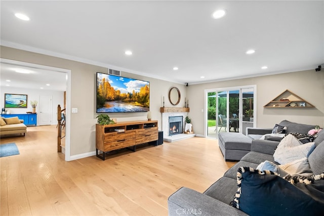 1161 Ravencrest Rd, North Tustin, CA 92705 - living room featuring recessed lighting, light wood-style floors, a lit fireplace, and ornamental molding