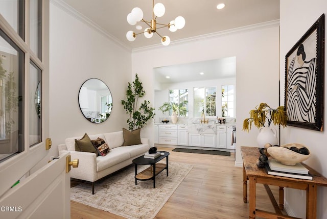 221 N 7th St, Santa Paula, CA 93060 - living room featuring crown molding, a chandelier, light wood-style flooring, and recessed lighting