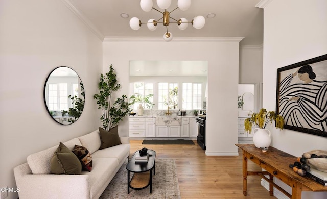 221 N 7th St, Santa Paula, CA 93060 - living room with crown molding, a chandelier, and light wood finished floors