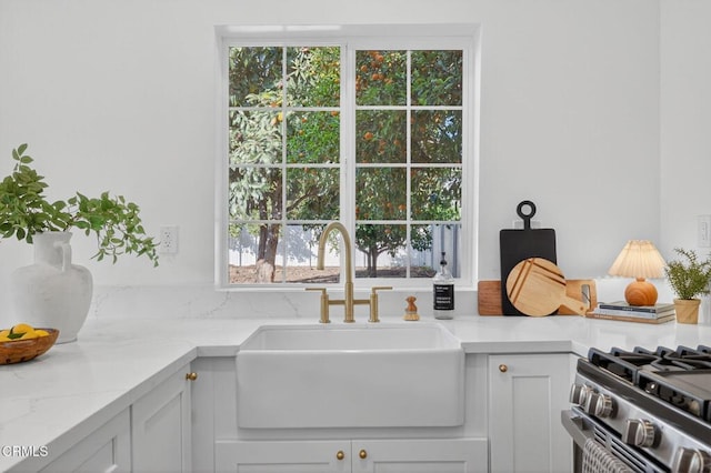 221 N 7th St, Santa Paula, CA 93060 - kitchen featuring white cabinetry and light stone counters