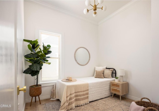 221 N 7th St, Santa Paula, CA 93060 - bedroom with a chandelier, wood finished floors, and ornamental molding