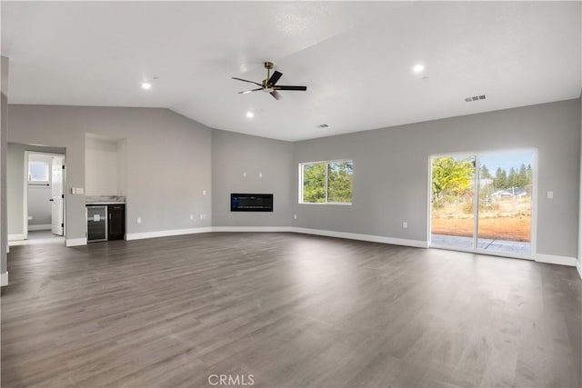 1671 Sweetbriar Ln, Paradise, CA 95969 - unfurnished living room with ceiling fan, lofted ceiling, dark wood-style floors, wine cooler, and recessed lighting