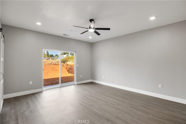 1671 Sweetbriar Ln, Paradise, CA 95969 - unfurnished room with ceiling fan, wood finished floors, recessed lighting, and a barn door