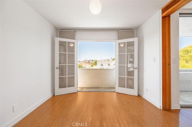 750 S Windsor Blvd Unit 7, Los Angeles, CA 90005 - unfurnished dining area with wood finished floors and french doors