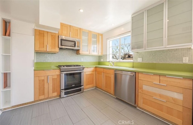 750 S Windsor Blvd Unit 7, Los Angeles, CA 90005 - kitchen with stainless steel appliances, tasteful backsplash, light brown cabinetry, open shelves, and recessed lighting