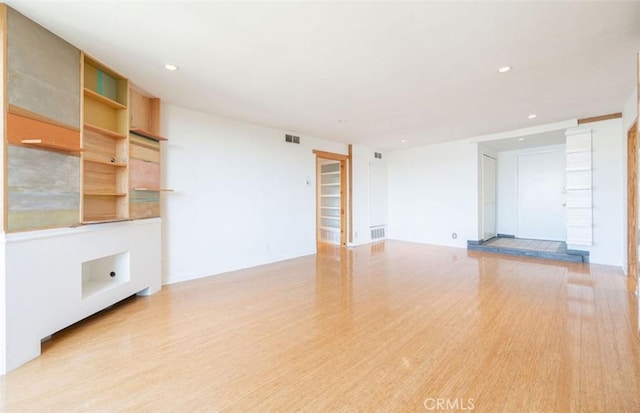 750 S Windsor Blvd Unit 7, Los Angeles, CA 90005 - unfurnished living room with recessed lighting and light wood-type flooring