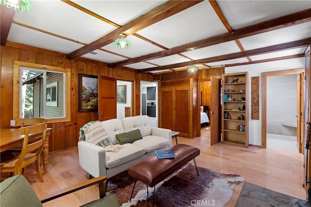 27917 Squirrel Ln, Lake Arrowhead, CA 92352 - living room with wooden walls, light wood-style flooring, and beam ceiling