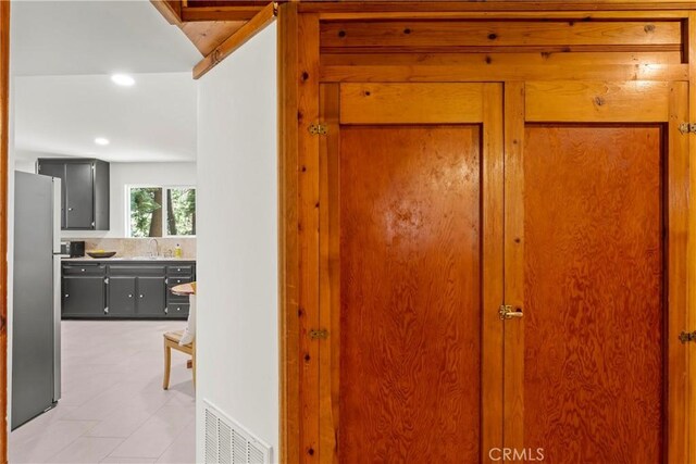 27917 Squirrel Ln, Lake Arrowhead, CA 92352 - hallway featuring recessed lighting, light tile patterned floors, and lofted ceiling