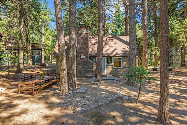 27917 Squirrel Ln, Lake Arrowhead, CA 92352 - back of property with a chimney