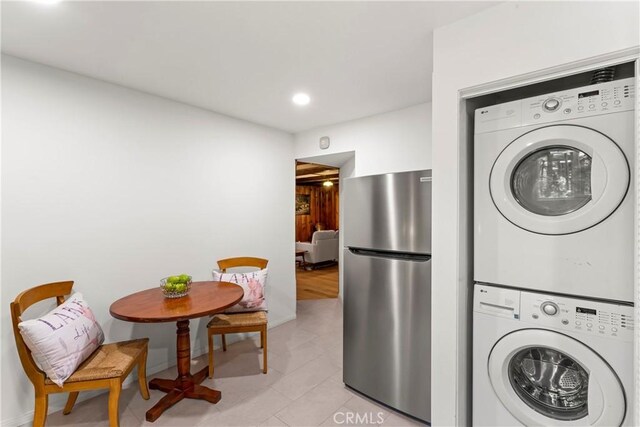 27917 Squirrel Ln, Lake Arrowhead, CA 92352 - laundry area with stacked washer / dryer, recessed lighting, and light tile patterned flooring