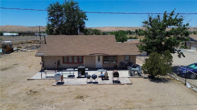 22731 Bryman Rd, Oro Grande, CA 92368 - view of front of property with a patio and roof with shingles