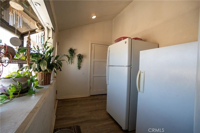 22731 Bryman Rd, Oro Grande, CA 92368 - kitchen featuring freestanding refrigerator, vaulted ceiling, dark wood-type flooring, and light countertops