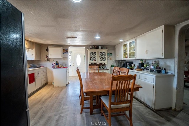 22731 Bryman Rd, Oro Grande, CA 92368 - dining area with a textured ceiling, light wood-style floors, and recessed lighting