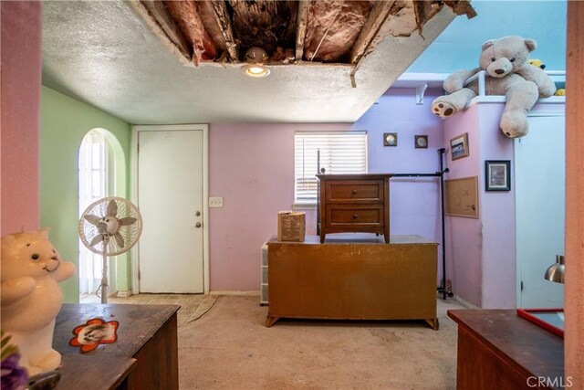 22731 Bryman Rd, Oro Grande, CA 92368 - interior space featuring light colored carpet and a textured ceiling