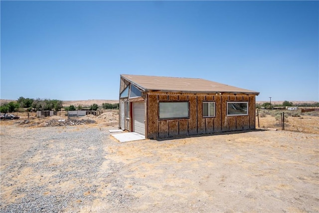 22731 Bryman Rd, Oro Grande, CA 92368 - view of front of house featuring board and batten siding and an outbuilding