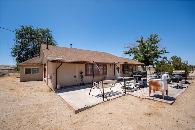 22731 Bryman Rd, Oro Grande, CA 92368 - back of property with a patio and stucco siding