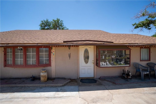 22731 Bryman Rd, Oro Grande, CA 92368 - view of exterior entry featuring roof with shingles