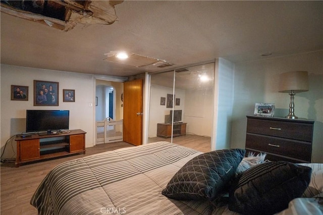 22731 Bryman Rd, Oro Grande, CA 92368 - bedroom featuring wood finished floors and a closet
