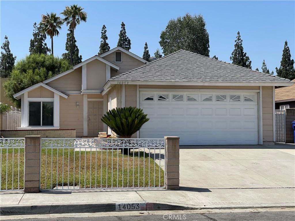 14053 Bluewood Dr, Fontana, CA 92337 - ranch-style home with concrete driveway and a garage