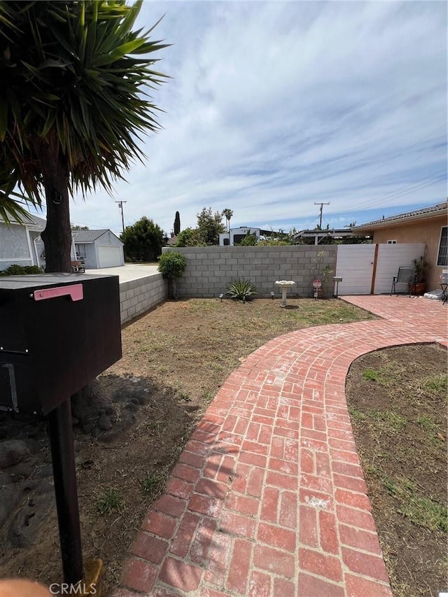 22605 Kinard Ave, Carson, CA 90745 - fenced backyard with a patio area
