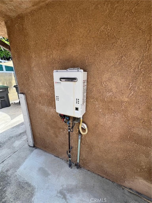22605 Kinard Ave, Carson, CA 90745 - exterior view of stucco siding and tankless water heater