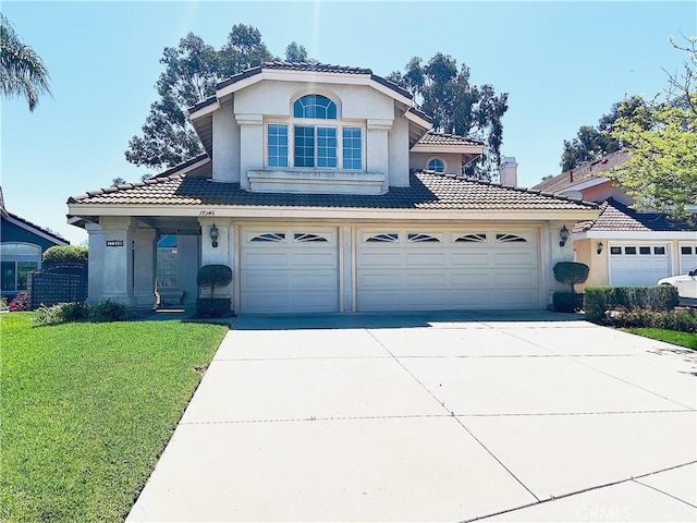 17346 Cold Spring Cir, Riverside, CA 92503 - view of front facade with stucco siding, a tiled roof, and concrete driveway