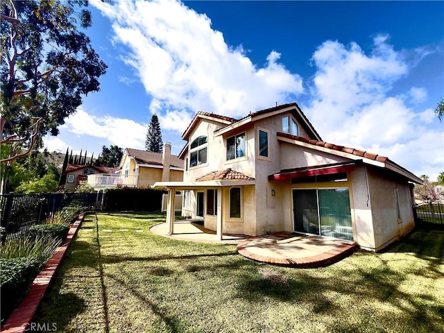 17346 Cold Spring Cir, Riverside, CA 92503 - rear view of property featuring stucco siding, a fenced backyard, a patio area, and a tile roof