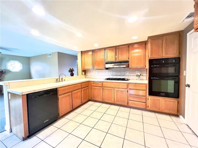 17346 Cold Spring Cir, Riverside, CA 92503 - kitchen featuring black appliances, under cabinet range hood, recessed lighting, a peninsula, and tasteful backsplash