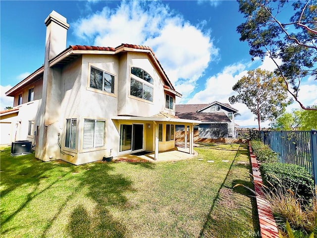 17346 Cold Spring Cir, Riverside, CA 92503 - back of property featuring stucco siding, a chimney, a fenced backyard, a patio area, and a tiled roof