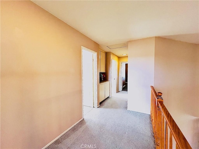 17346 Cold Spring Cir, Riverside, CA 92503 - hallway featuring light carpet, an upstairs landing, and attic access