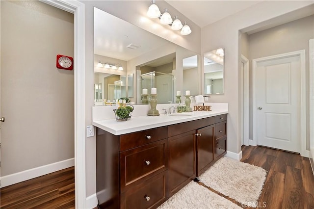 27843 Huron Ct, Menifee, CA 92585 - bathroom featuring vanity, a stall shower, and wood finished floors