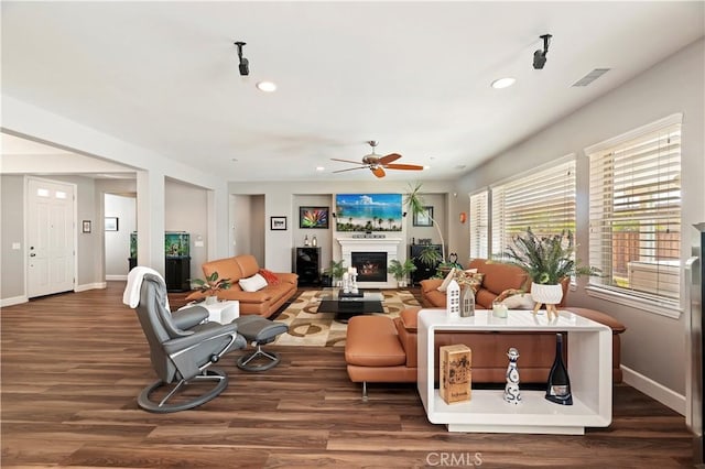 27843 Huron Ct, Menifee, CA 92585 - living area featuring a ceiling fan, wood finished floors, recessed lighting, and a lit fireplace
