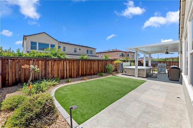 27843 Huron Ct, Menifee, CA 92585 - fenced backyard with a hot tub, a ceiling fan, a patio area, and a residential view