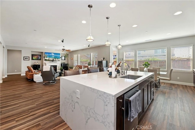 27843 Huron Ct, Menifee, CA 92585 - kitchen featuring recessed lighting, dark wood-type flooring, a ceiling fan, pendant lighting, and a kitchen island with sink