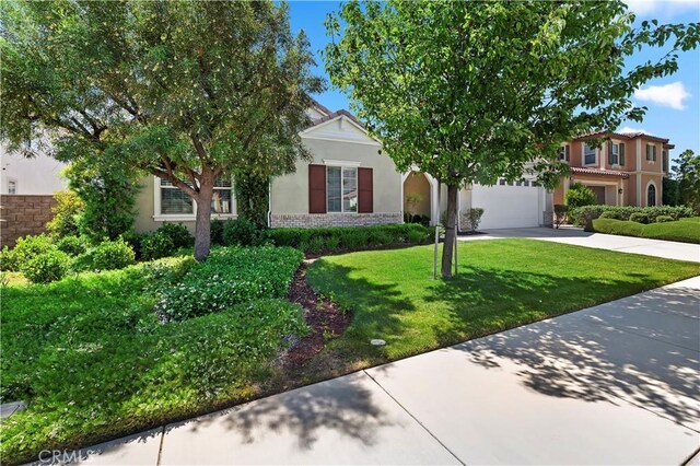 27843 Huron Ct, Menifee, CA 92585 - obstructed view of property featuring concrete driveway, stucco siding, and a front lawn