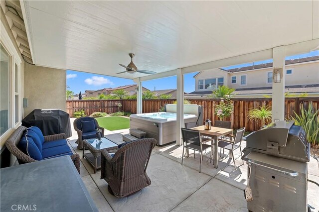 27843 Huron Ct, Menifee, CA 92585 - fenced backyard featuring a hot tub, area for grilling, an outdoor living space, and a patio