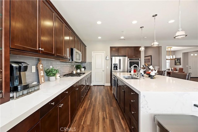 27843 Huron Ct, Menifee, CA 92585 - kitchen featuring stainless steel appliances, dark wood-style floors, decorative backsplash, pendant lighting, and recessed lighting