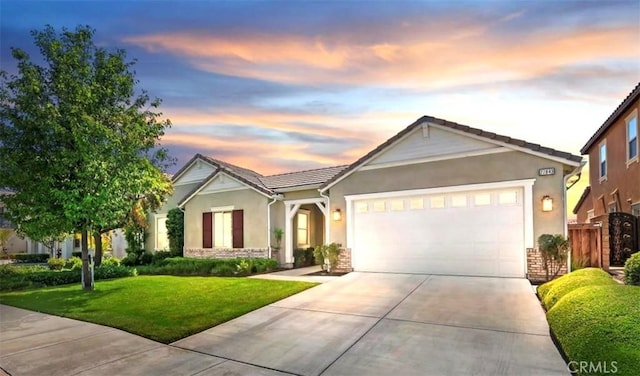 27843 Huron Ct, Menifee, CA 92585 - ranch-style home featuring a garage, driveway, stucco siding, and stone siding
