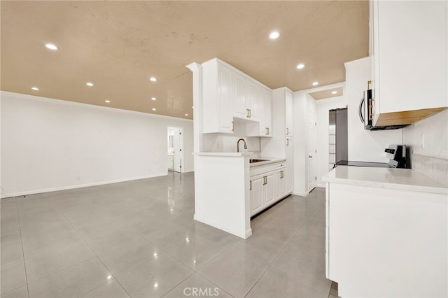 5320 Zelzah Ave Unit 106, Encino, CA 91316 - kitchen featuring range, recessed lighting, white cabinets, light countertops, and light tile patterned flooring