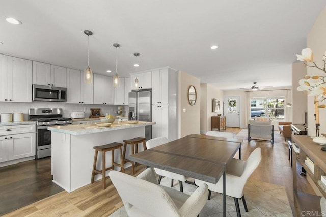 3585 Redwood St, San Diego, CA 92104 - dining area featuring wood finished floors, ceiling fan, and recessed lighting
