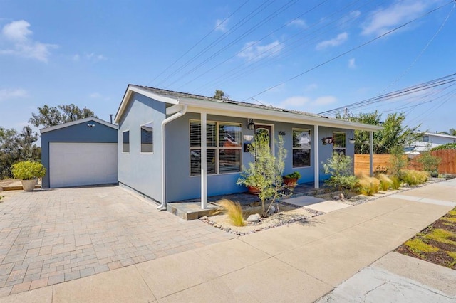 3585 Redwood St, San Diego, CA 92104 - view of front of house featuring covered porch, stucco siding, a garage, and decorative driveway