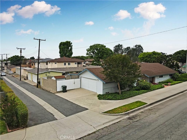 13924 2nd St, Whittier, CA 90605 - view of front of property with a residential view, concrete driveway, and a detached garage
