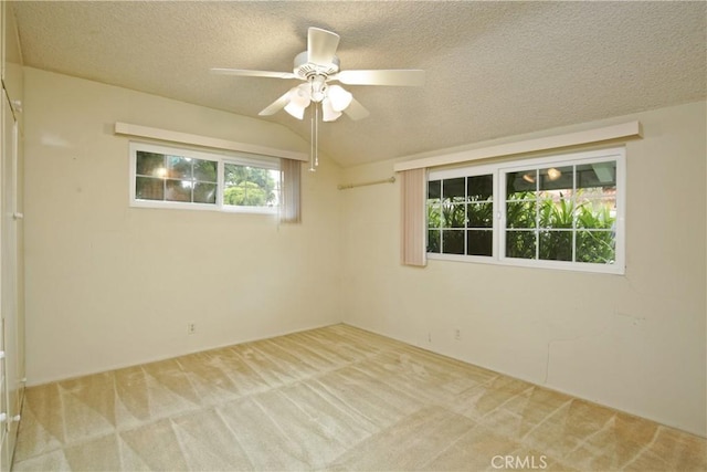 13924 2nd St, Whittier, CA 90605 - unfurnished room with carpet, a ceiling fan, a textured ceiling, and vaulted ceiling