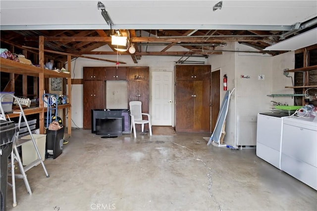 13924 2nd St, Whittier, CA 90605 - garage with washer and clothes dryer and a garage door opener